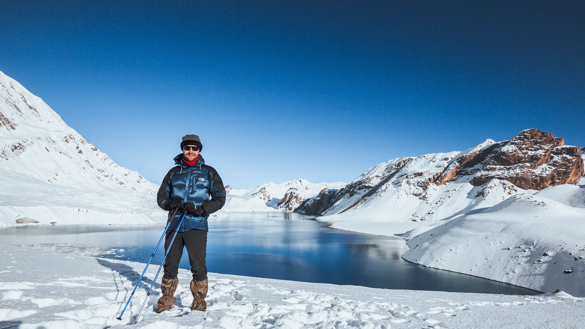 Client standing at Tilicho Lake
