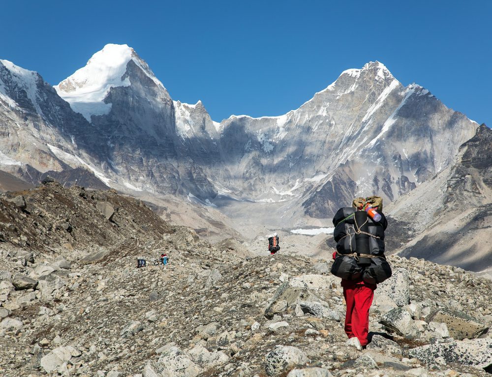 Everest Three Passes Trek porter with trekkers